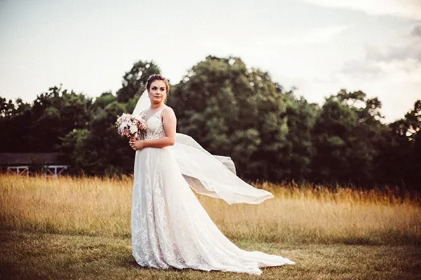 Bridal photoshoot with wedding gown flowing in the wind